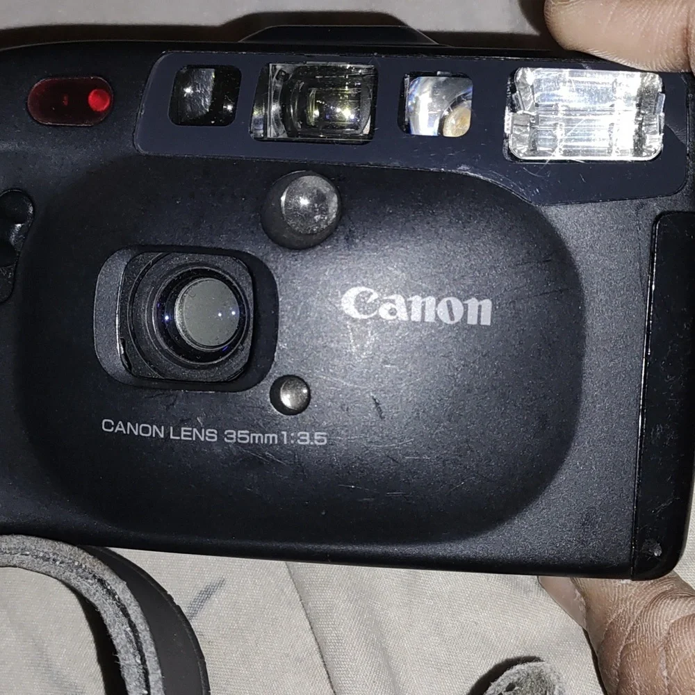 Vintage Canon camera and Canon bag with brush cleaner